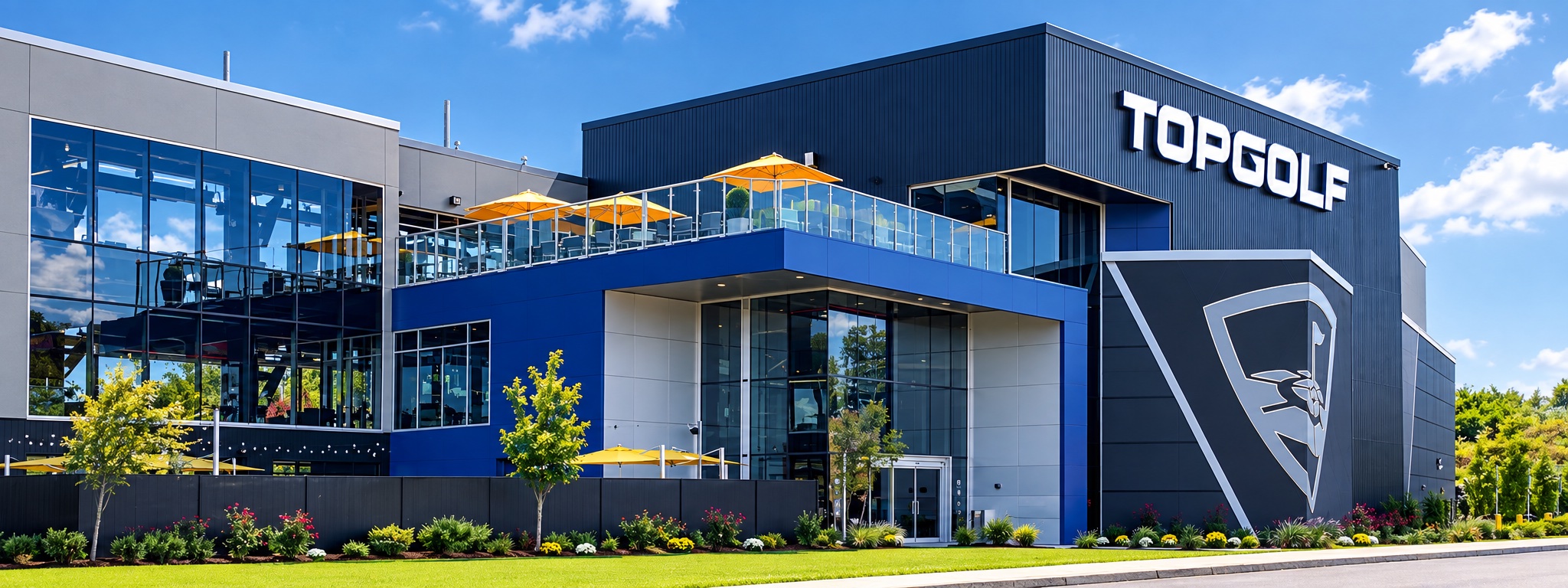 Topgolf venue exterior with metal panels, blue ACM cladding and glazing